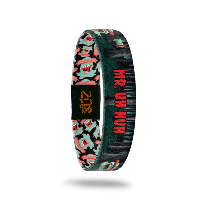 Product photo of the inside of 2020 - Day 11 - Mr. Uh Huh: forest design displaying mint green monster with red eyebrows and red 'MR. UH HUH' text