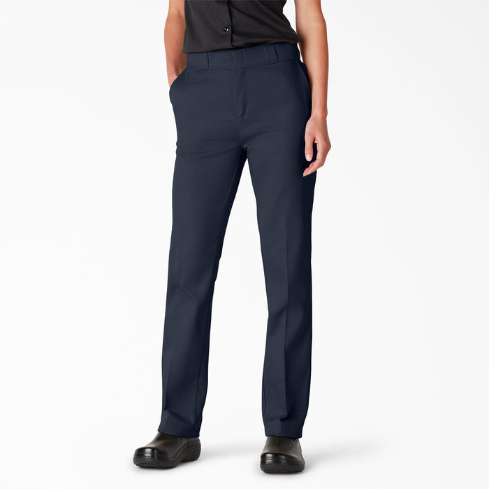 Women's navy blue work pants with straight legs and front pockets, worn with black shirt and shoes.