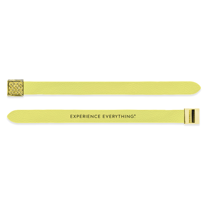 Outside Design of the V2 Imperial Yellow Solid: vegan leather material with printed on yellow background and gold buckle clasp. And Inside Design of the V2 Imperial Yellow Solid: vegan leather material with printed on yellow background with black text ‘Experience Everything’ and gold buckle clasp
