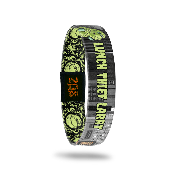 Product photo of inside of 2020 - Day 10 - Lunch Thief Larry: gray and black design with green monster and 'LUNCH THIEF LARRY' text