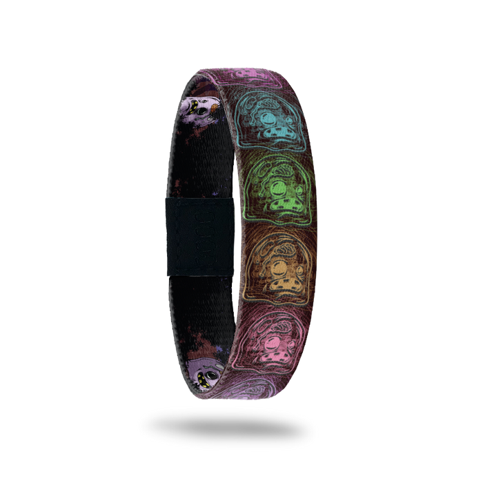Product photo of the outside of 2020 - Day 19 - Big Brain Brad: black design with repeating multi-colored monsters with little brains, one eye smaller than the other, and five teeth