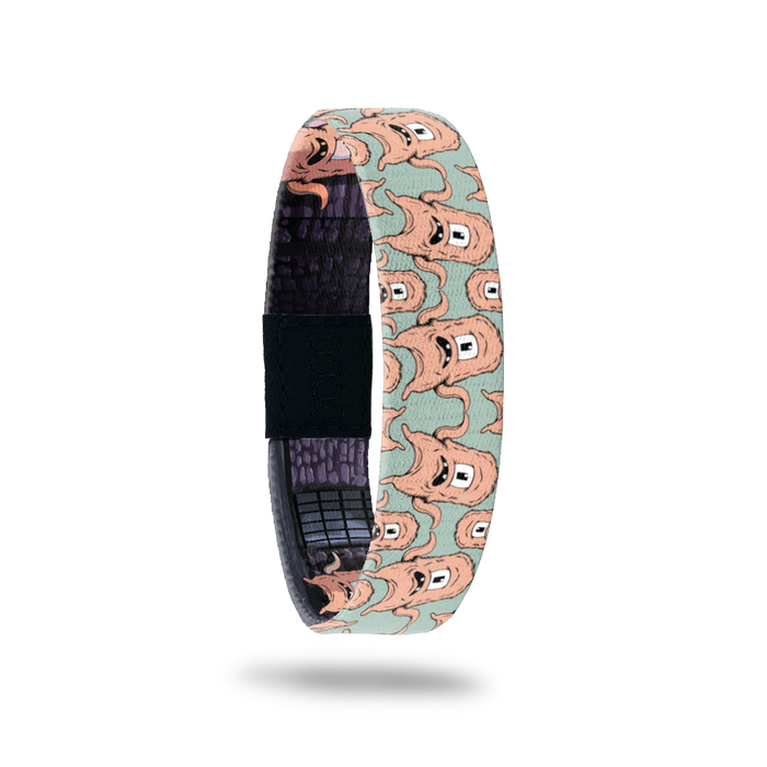 Product photo of the outside of 2020 - Day 22 - Welpy: green design with repeating furry, peach monsters with one eye and two teeth