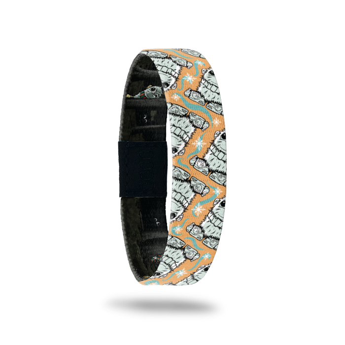 Product photo of the outside of 2020 - Day 29 - Mr. Warm Neck: orange, teal, and white design with repeating furry, gray monster wearing a gray striped scarf and shoes with his toes coming out of the front