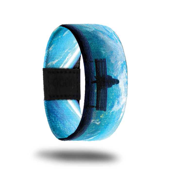 Product photo of the outside of 2020: blue toned design with artwork of a person sitting on a park bench looking at the world from outer space