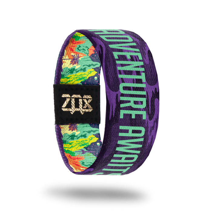 Adventure Awaits-Sold Out-ZOX - This item is sold out and will not be restocked. Purple base with orange, yellow and green beach scene. The inside is the same and says Adventure Awaits in teal.