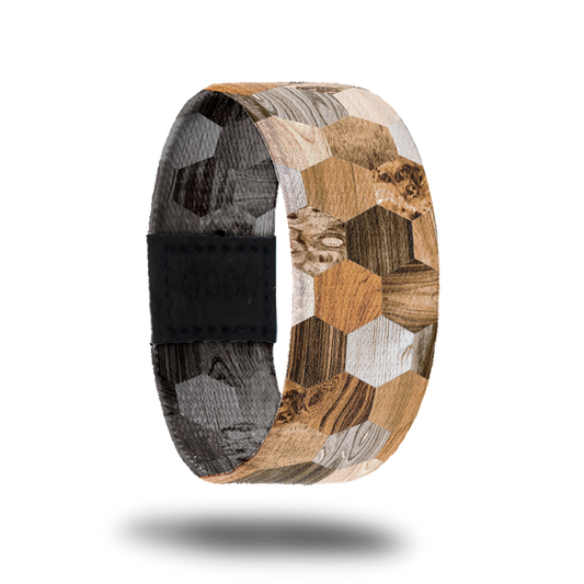 Outside design of Against the Grain: hexagon shapes with a variety of different types of wood grain.