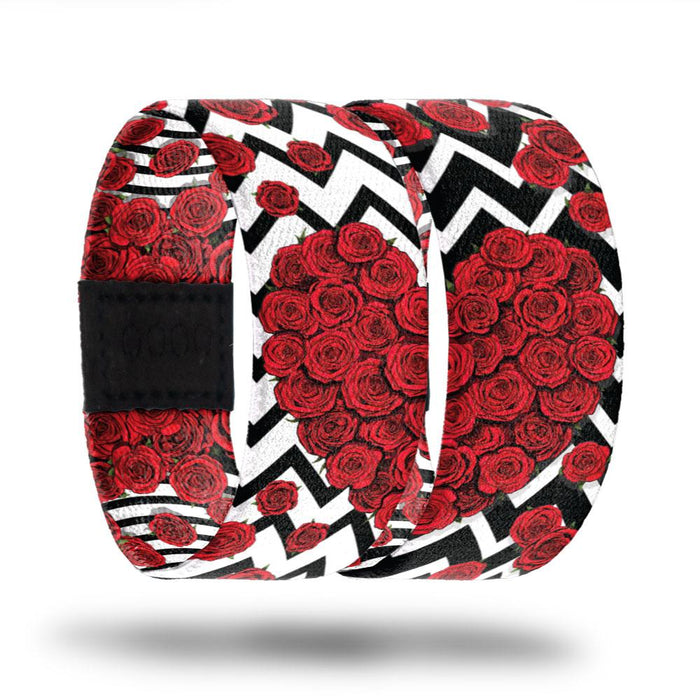 Comes with two straps, one black on white design and one white on black design. Both covered in roses that if put next to each other, form a heart. The inside is the same and one reads Always, the other reads Forever.