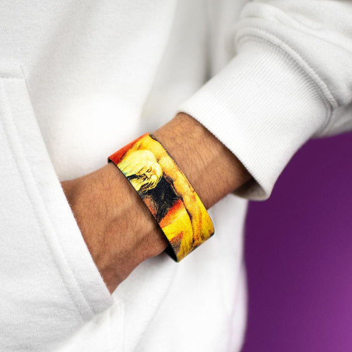 Studio image close up of wrist in sweater pocket wearing Ancient Of Days