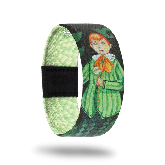 Assume Nothing-Sold Out-ZOX - This item is sold out and will not be restocked. Green strap with light green diamond shapes and leaves. Has a red-headed boy in all green and says "dum" on his collar. Inspired by Alice in Wonderland's Tweedle Dee and Tweedle Dum. This is part of the Wonderland mini collection.