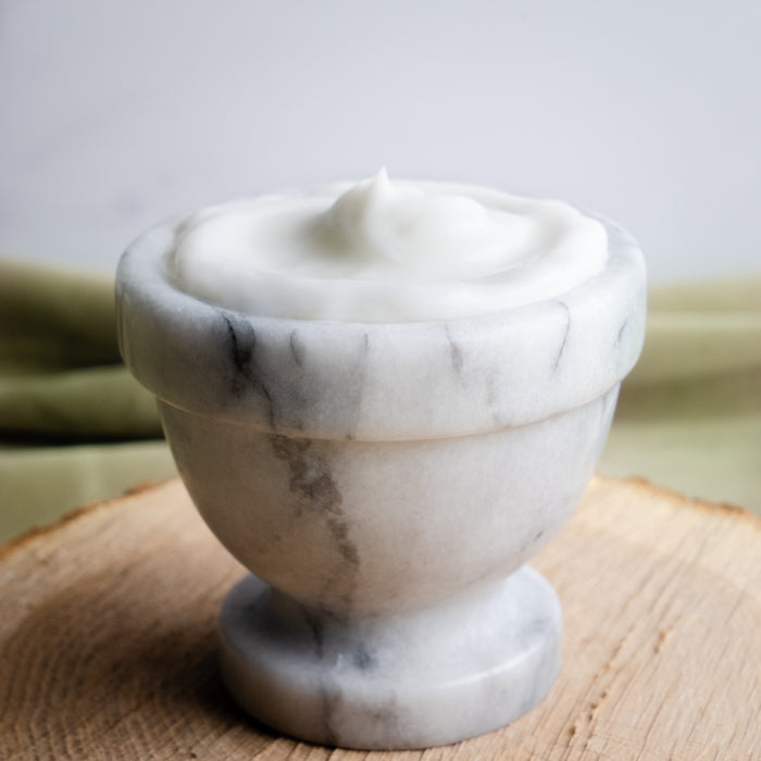Rustic Strength, Avocado Lotion in a marble dish
