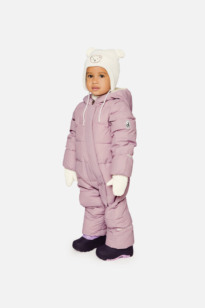 Baby standing in the lavender Deux par Deux Baby Cloud snowsuit, three-quarter front view