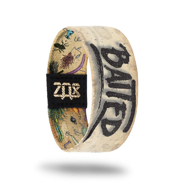 Inside design of Baited with a tan background and Baited in a faded black text