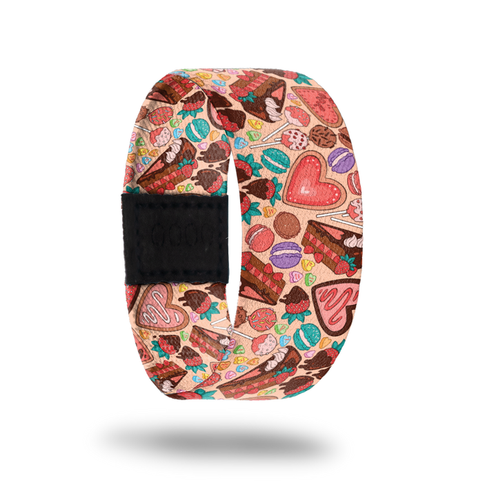 Be Sweet-Sold Out-ZOX - This item is sold out and will not be restocked. Pale pink strap with tons of multicolored desserts- suckers, cookies, pie, macaroons, candy hearts. Inside is the same design and reads Be Sweet To Yourself.