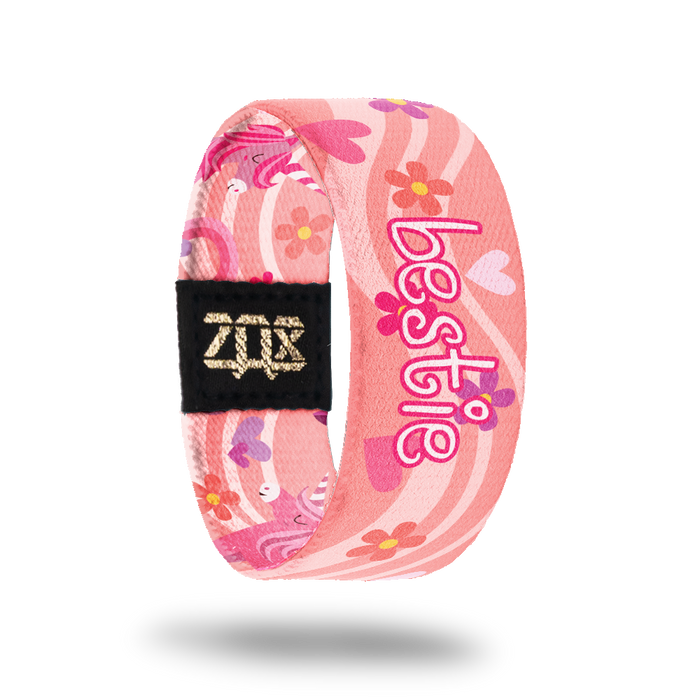 Inside design for Bestie, A pink background with a lighter pink wave that goes across the design. Flowers and hearts in shades of pink and Bestie in white and pink text at the center