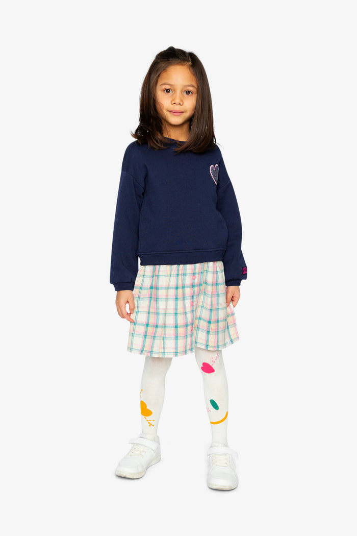 Deux par Deux girls' bi-material dress in dark blue with plaid skirt – worn by a child