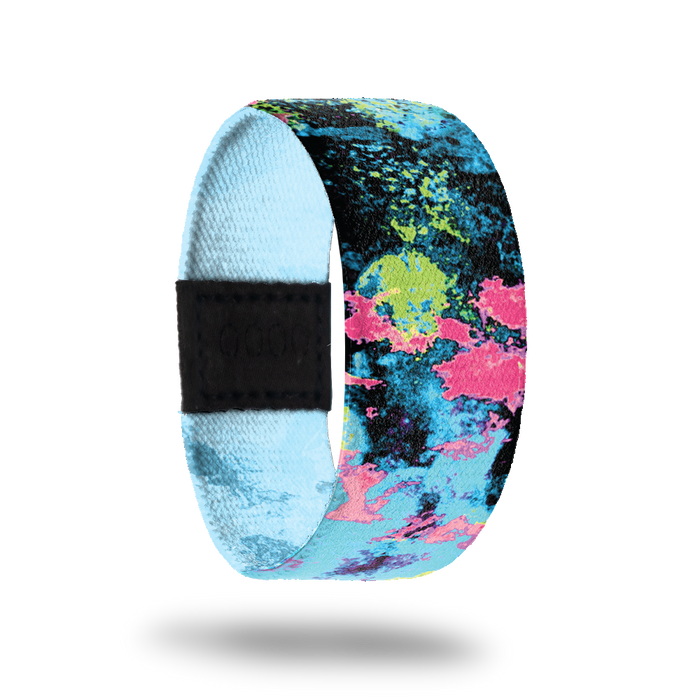 Blacklight-Sold Out-ZOX - This item is sold out and will not be restocked. A blacklight image with each shadow highlighted in different colors- black, teal, neon green and pink. Inside is solid blue and reads Blacklight.