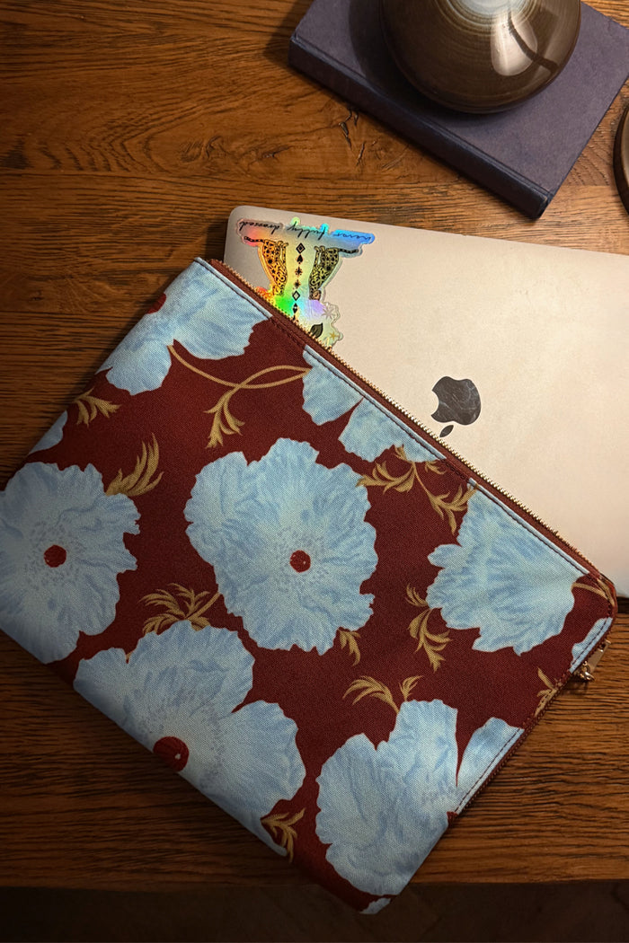 Blue & Burgundy Poppy Laptop Case with a bold floral print and zip closure, designed in-house for your tech essentials.