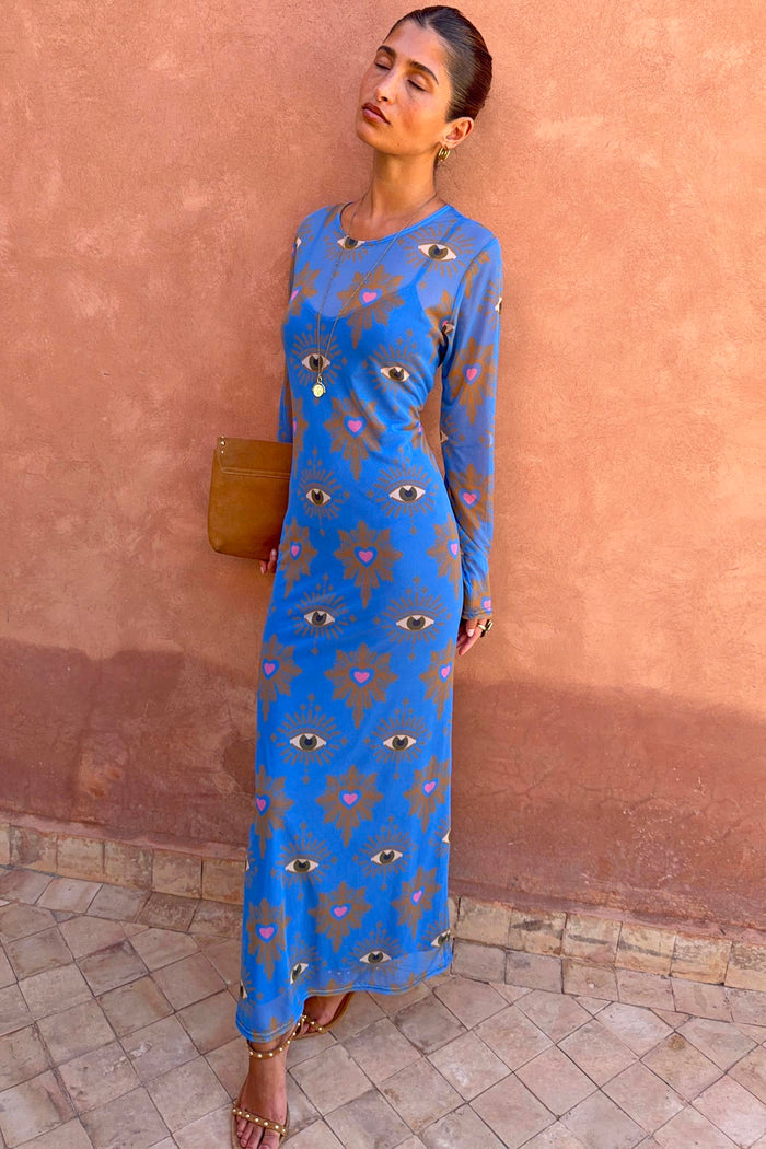 Blue Eye Mesh Dress Petite featuring a heart and eye print and long sleeves, styled with a clutch for vacation.