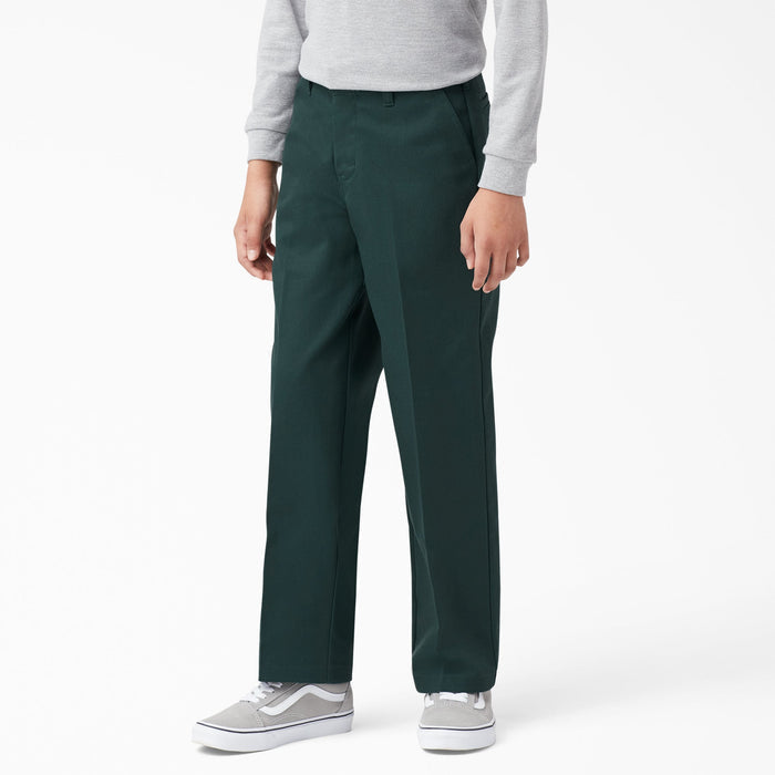 Boy wearing dark green classic fit pants with gray long-sleeve shirt and gray sneakers.