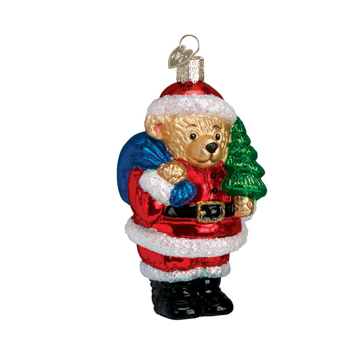 Santa bear glass ornament of a teddy bear in a Santa suit holding a Christmas tree