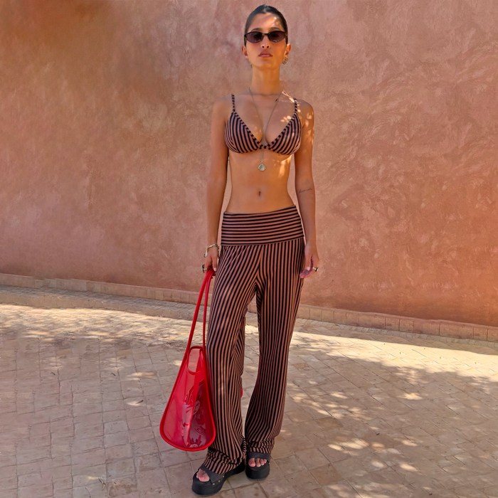 Chocolate Stripe straight leg Fold Over Pants in ribbed fabric with matching bikini top, red mesh bag and sunglasses.