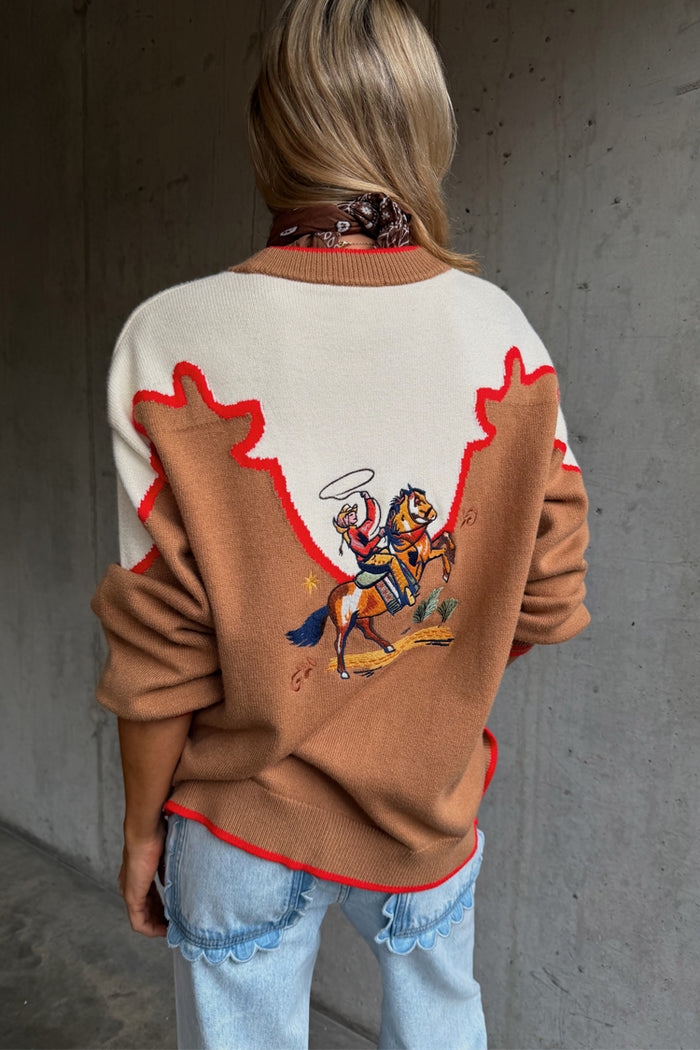 Cowgirl Martha Cardigan in tan with an embroidered western motif, cream contrast yoke and red stitching.