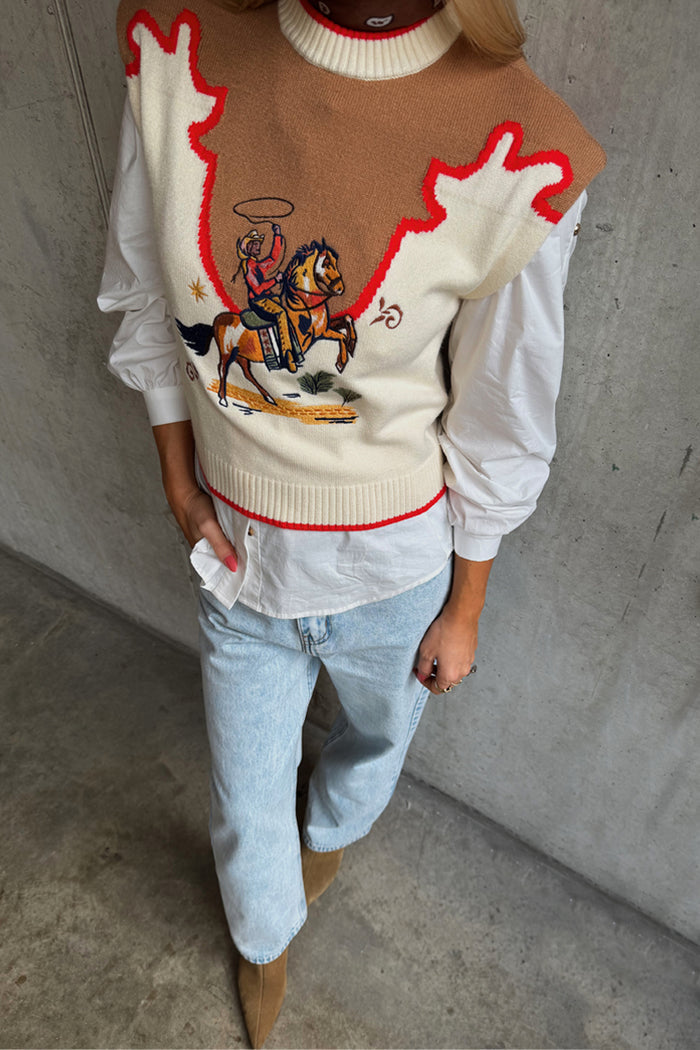 Cowgirl Ro Knitted Tank in cream with a tan western yoke, red contrast stitching and an embroidered cowgirl motif.