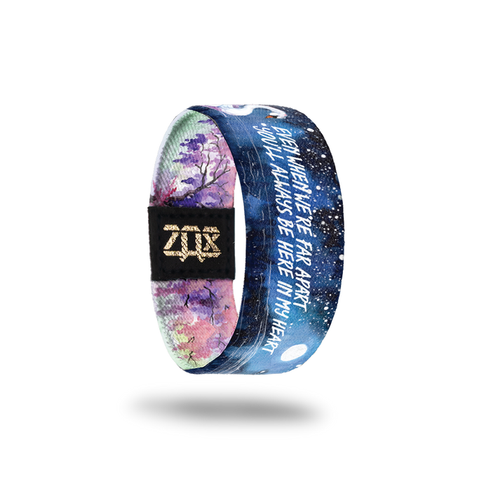 Inside Design of Even When We’re Far Apart kids size: watercolor night sky with a swan swimming in the water and white text in the middle ‘Even when we’re far apart you’ll always be here in my heart’