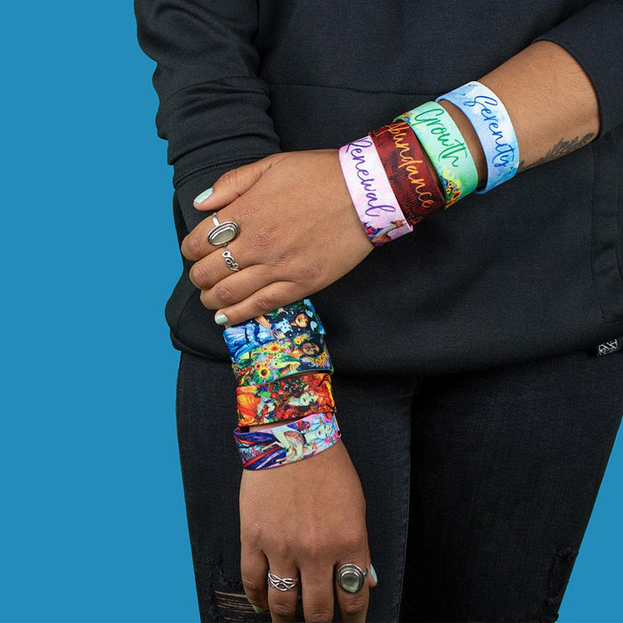 Studio Image of all four designs of the Fairies pack on both arms of model. One arm shows inside designs and the other arm shows the outside design.