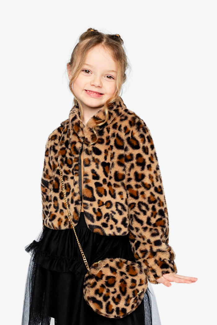 Girl wearing the brown leopard print faux fur jacket with a matching leopard purse, front view