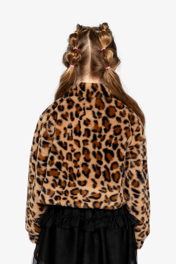 Girl wearing the brown leopard print faux fur jacket, back view