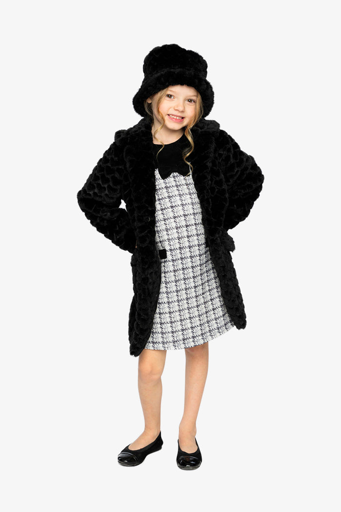 Girl standing in the Deux par Deux black faux fur long coat with a black hat, front view