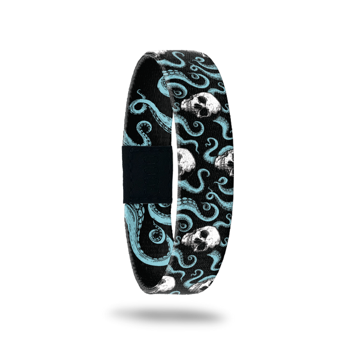Single wristband with black base and teal octopi all over. White skulls around the tentacles. Inside reads Fight For What You Believe In.
