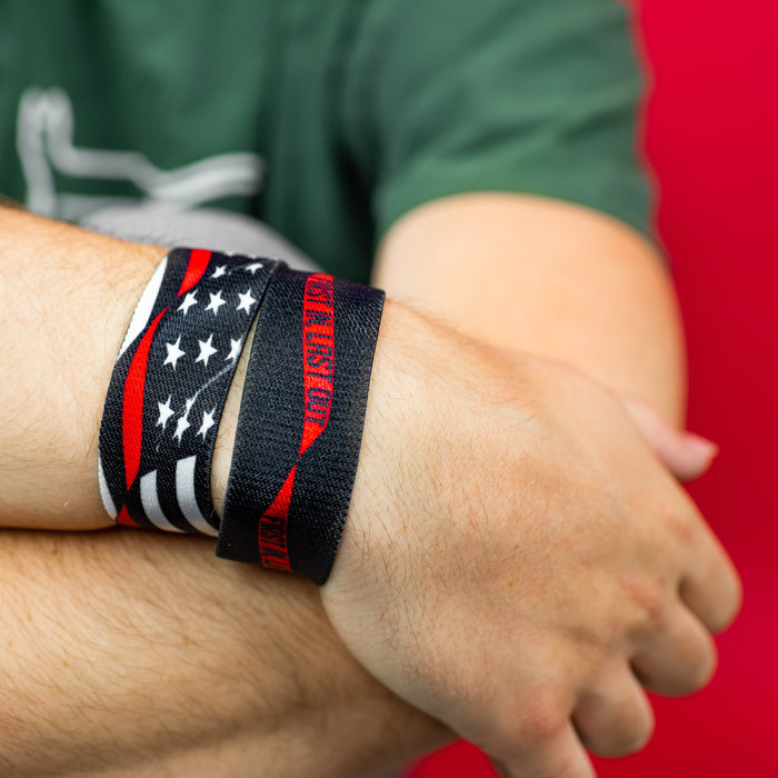Studio close up image of 2 First In, Last Out on 1 wrist