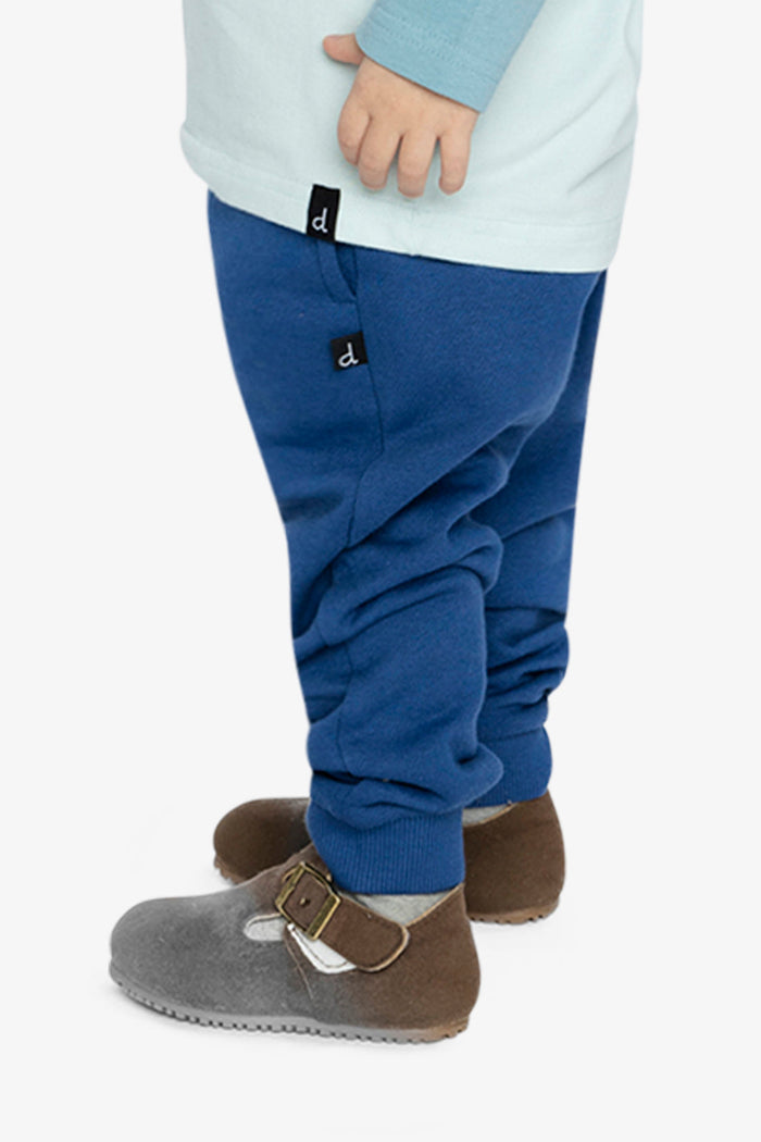 Child wearing Deux par Deux fleece jogger sweatpants in blue, lookbook view 2