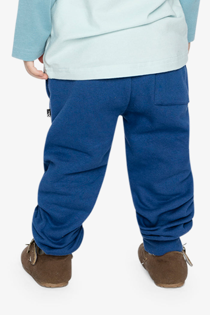 Child wearing Deux par Deux fleece jogger sweatpants in blue, lookbook view 3