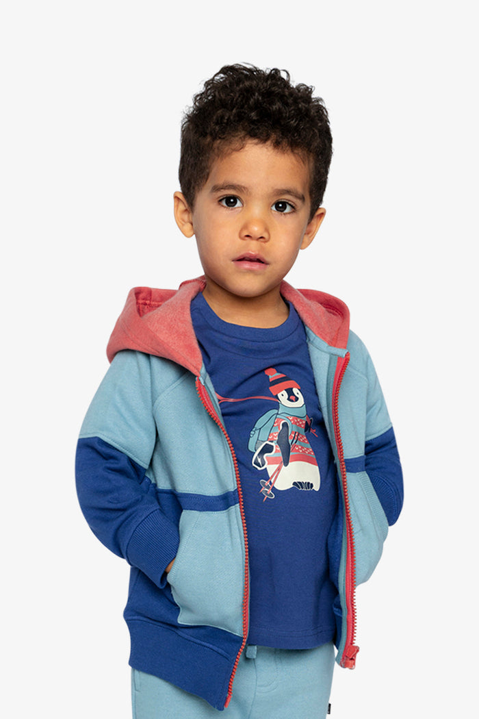 Boy wearing the Deux par Deux blue, turquoise and orange hooded fleece jacket open, front view