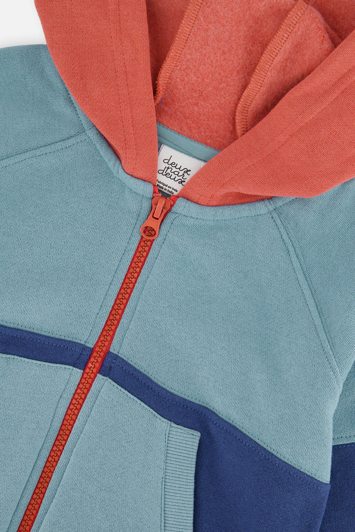 Close-up of the orange zipper and hood on the Deux par Deux boys fleece jacket
