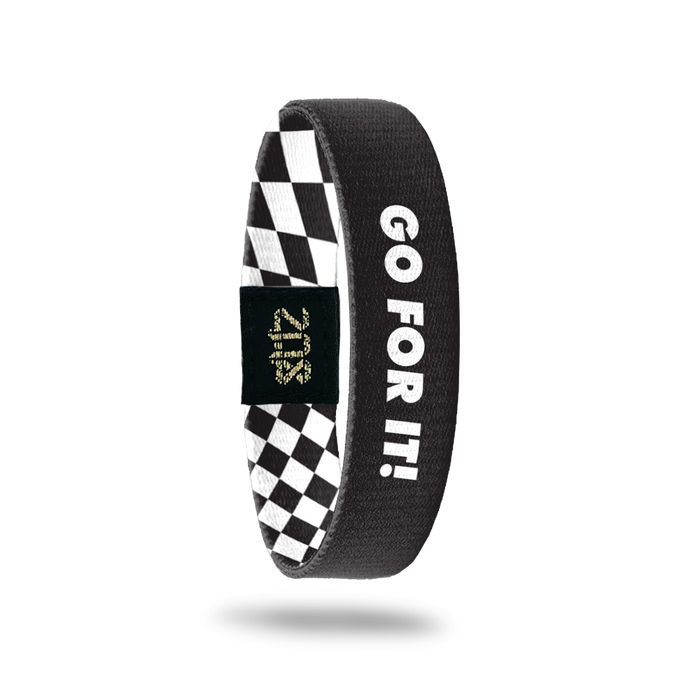 Inside Design of Go For It: simple black ground with bold white overlaying text ‘Go For It!’