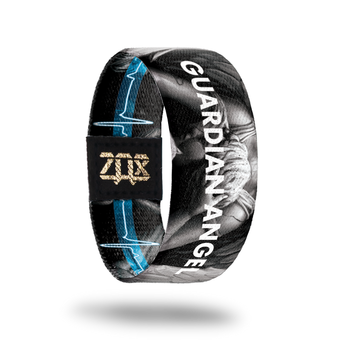Inside design of Guardian Angel, grayscale angel in the center of black background with Guardian Angel in blue transparent text over the angel