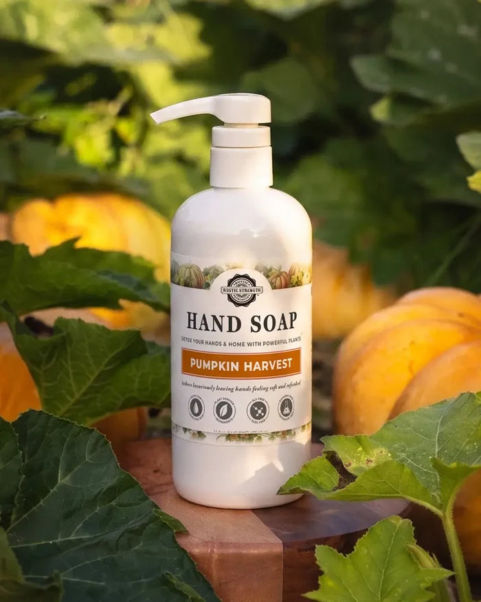 Rustic Strength, 16 oz bottle of Pumpkin Harvest Hand Soap sitting in a pumpkin patch.