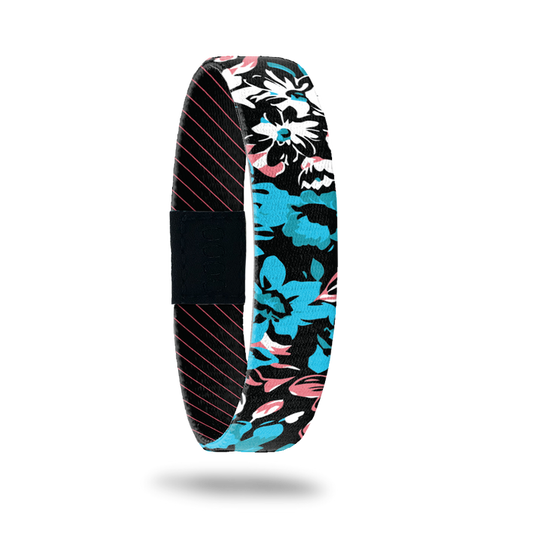 Product photo of outside design of hang loose with neon tropical flower print overlaying black background