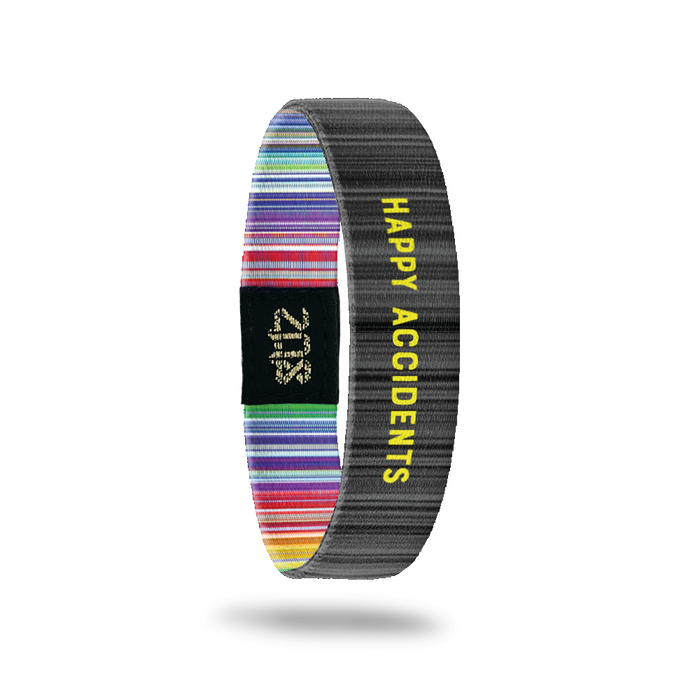 Inside Design of Happy Accidents: dark and light grey striped design with yellow text ‘Happy Accidents’