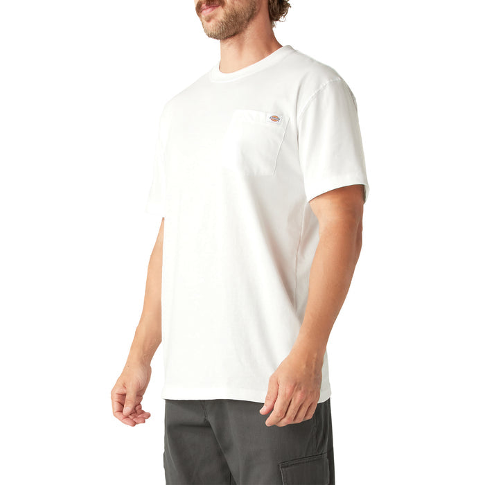 Man wearing cream short-sleeve t-shirt with chest pocket and gray cargo shorts.