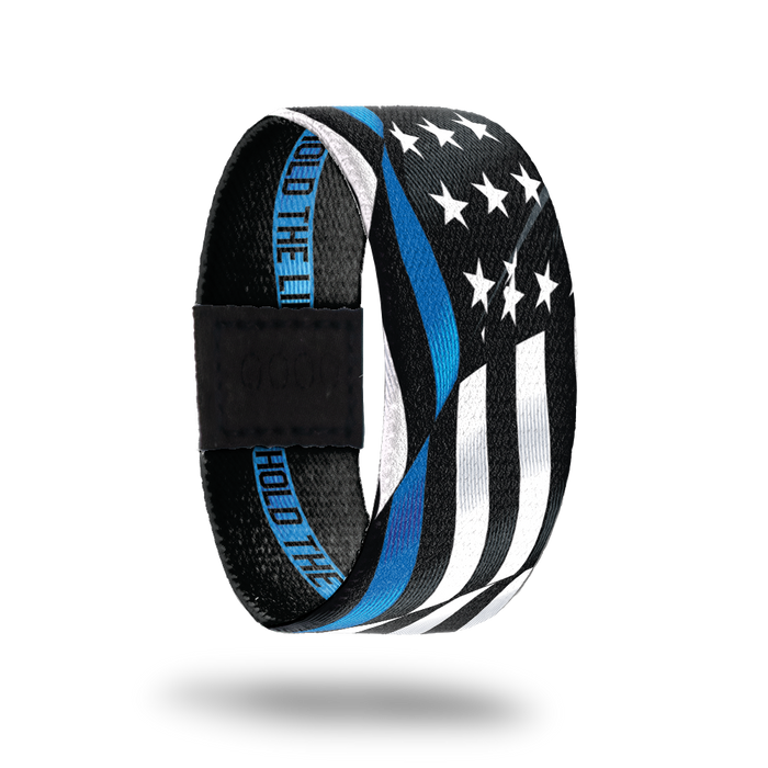 Outside Design of Hold The Line. wavy black and white United States flag with a line of blue for one bottom stripe of the flag