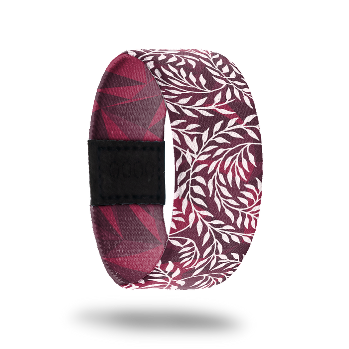 Outside design of Hope Over Fear. Red background with illustrated leafy vines across the design