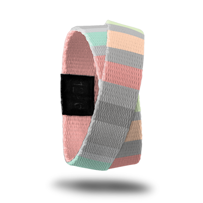 Outside design of How Will You Be Remembered? Subtle knitted look to the design with varying width sizes of rectangles of colors like gray, pink, light orange,and light green. This product, called a double, is thinner and wraps around your wrist twice with the material crossing at one point.