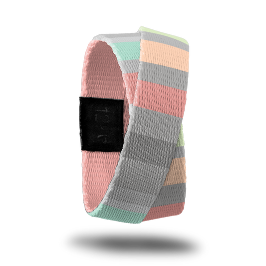 Outside design of How Will You Be Remembered? Subtle knitted look to the design with varying width sizes of rectangles of colors like gray, pink, light orange,and light green. This product, called a double, is thinner and wraps around your wrist twice with the material crossing at one point.