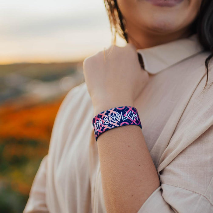 Lifestyle close up of I Am Enough on someone's wrist