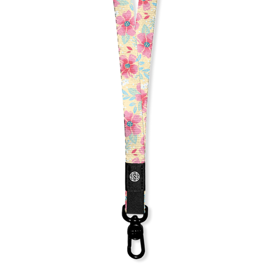 Lanyard with pale yellow base and pink flowers all over. The Inside says I Choose Joy and the lanyard has a metal clip for keys/cards. Each lanyard comes with 2 clips if you need to make a breakaway lanyard.